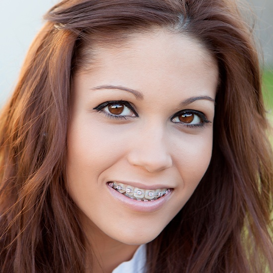 Smiling woman with adult orthodontics