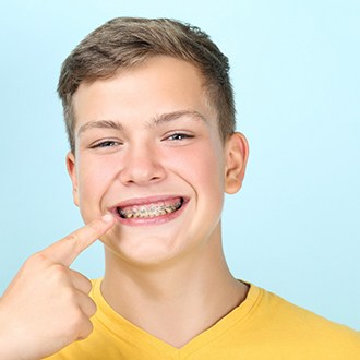 a patient with braces smiling