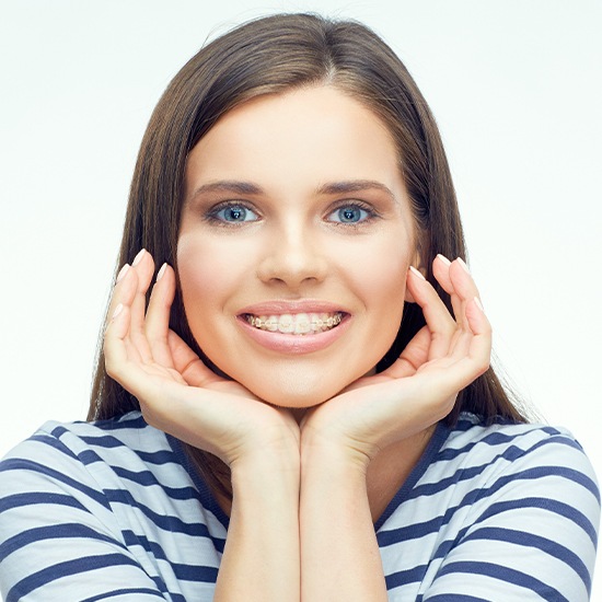 Woman with clear and ceramic braces