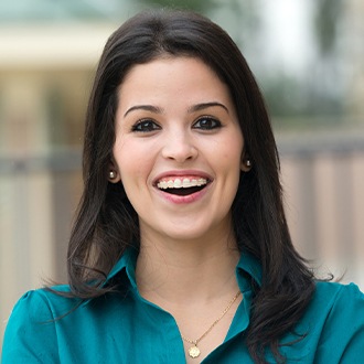 Woman with clear and ceramic braces smiling