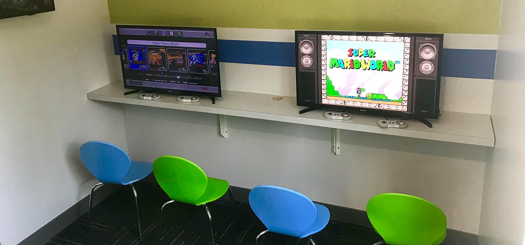 Kid friendly gaming area in orthodontic office waiting room