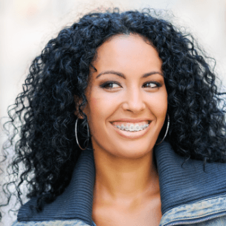 Woman with clear and ceramic braces