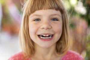 Smiling girl with pediatric braces in Grafton